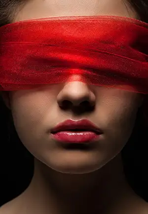Woman's face with a red blindfold