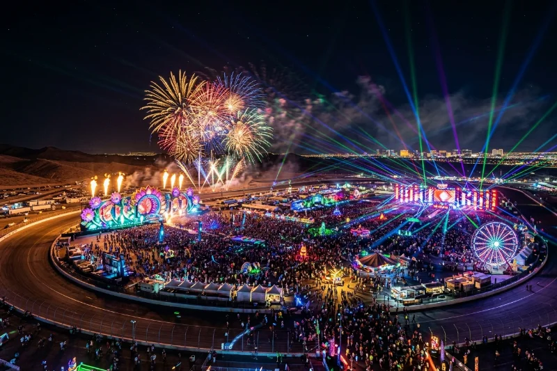 Aerial view of the Electric Daisy Carnival festival with colorful lights and fireworks in Las Vegas.
